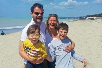 Christopher mit Familie am Strand
